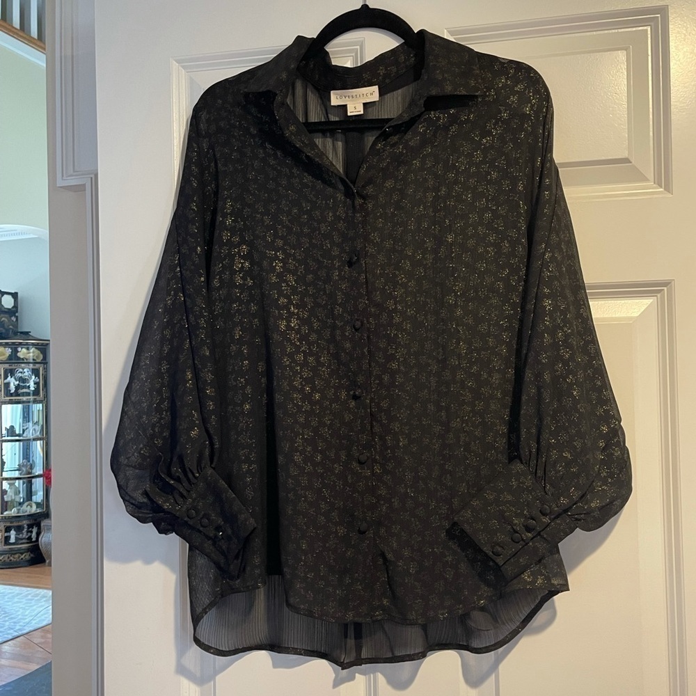 Good condition black and gold sheer blouse.  Sz small
